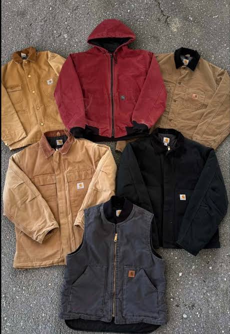 Vintage Carhartt jackets and vests — duck canvas work coats in tan, brown and black
